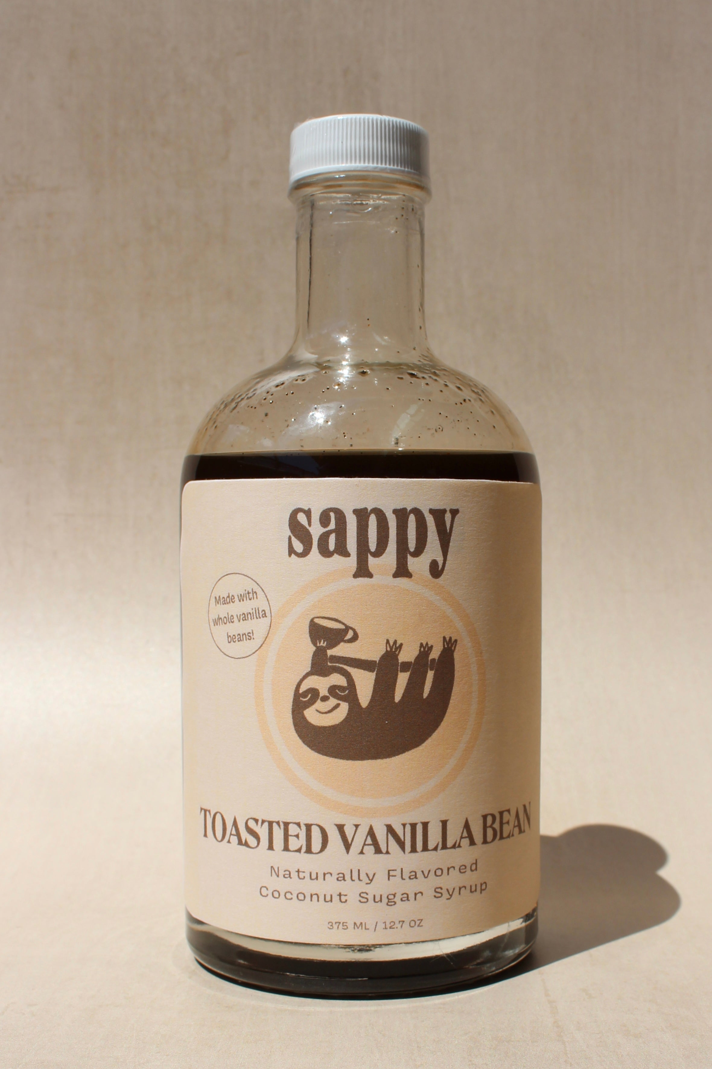 Bottle of sappy toasted vanilla bean coconut sugar syrup used for coffee and tea